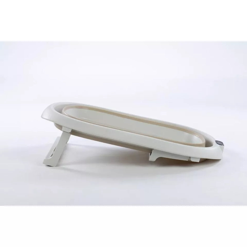 Sulankstoma kūdikio vonelė su termometru ir silikoniniu gultuku BATH&CARE Beige